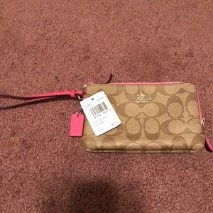 Hot pink and brown Coach wristlet